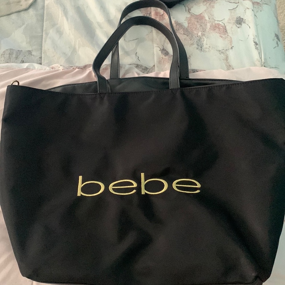 Bebe black tote. Find embroidered logo in gold. Excellent condition